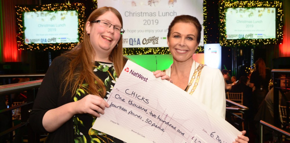 Mabel Duncombe accepts a cheque from the East Midlands Chamber