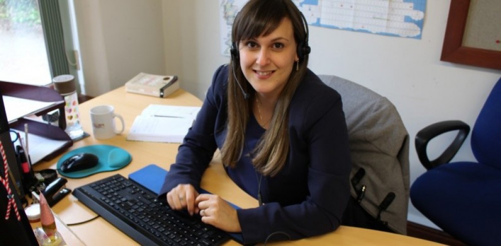 A volunteer in the CHICKS office in Devon
