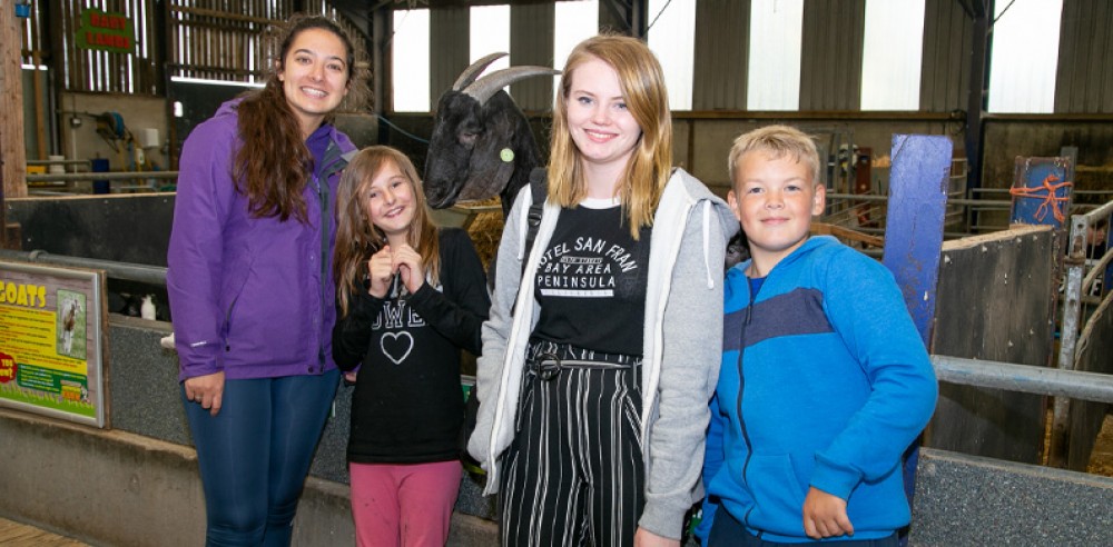Volunteers with children at the adventure park